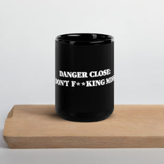Danger Close warning on our black Glossy Mug